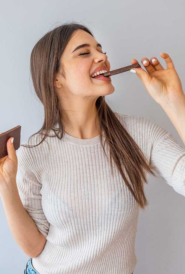 woman eats ChoViva chocolate
